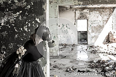 The girl in a gas mask. The threat of ecology. Stock Photo